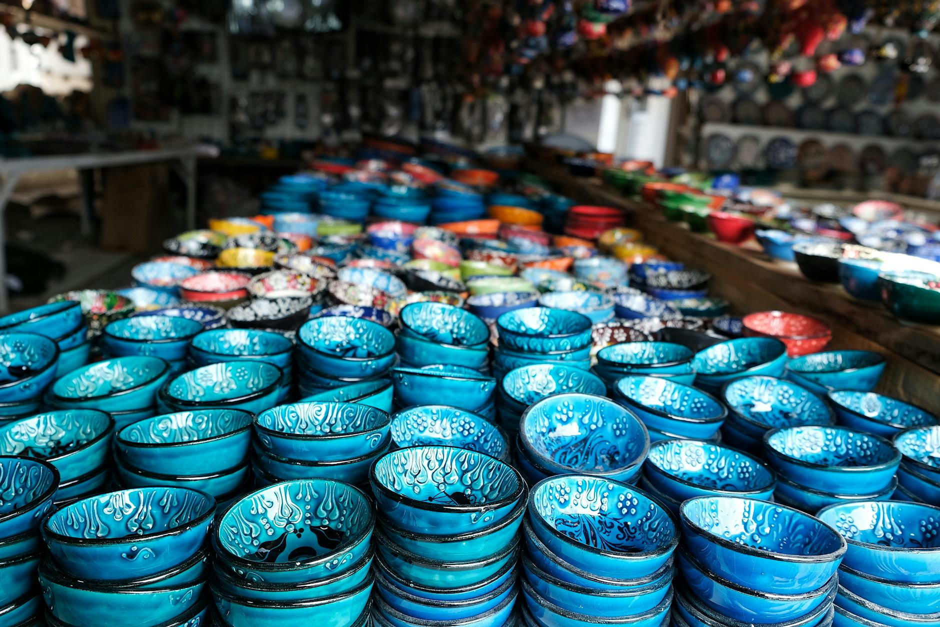 rows of ceramic bowls in a souvenir store
